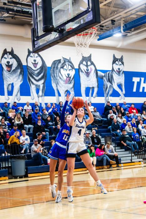 Ashley Brewer shows her strength under the hoop as she goes up for a bunny against Canton Dec. 7. She scored 9 points against Canton and 14 points against Madison. Photo by Peterman Sports Photography • stevepeterman5@gmail.com
