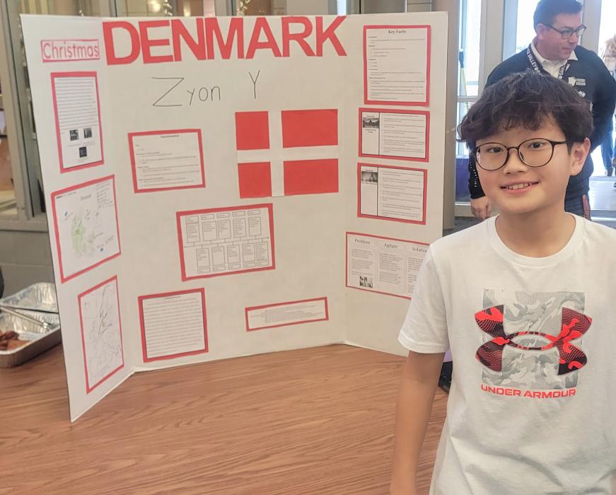 Seventh grader Zyon Yi, of Dakota Dunes, provided information about Denmark to those who approached his display at the Culture Fair on Dec. 20. Photo by Kelly Riibe • times2reporter@gmail.com