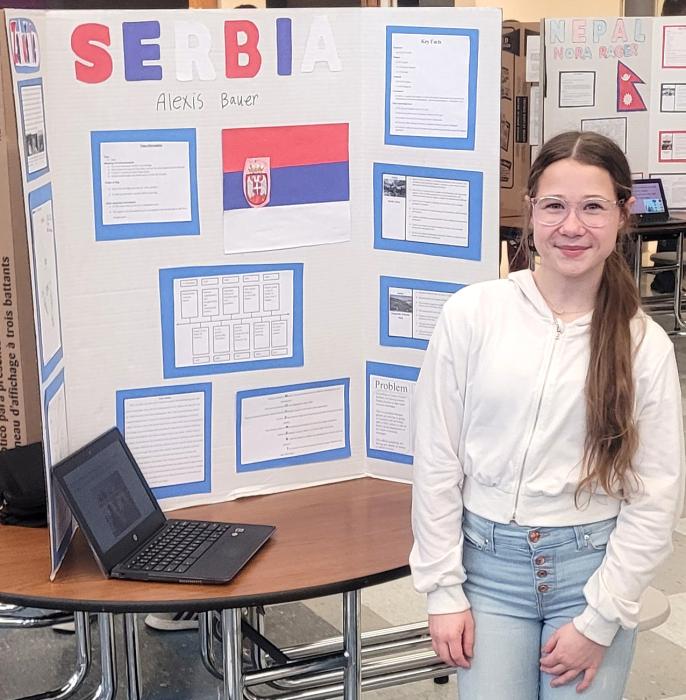 Alexis Bauer, of Jefferson, showcased her research on Serbia for the 7th Grade Culture Fair on Wednesday, Dec. 20. Photo by Kelly Riibe • times2reporter@gmail.com