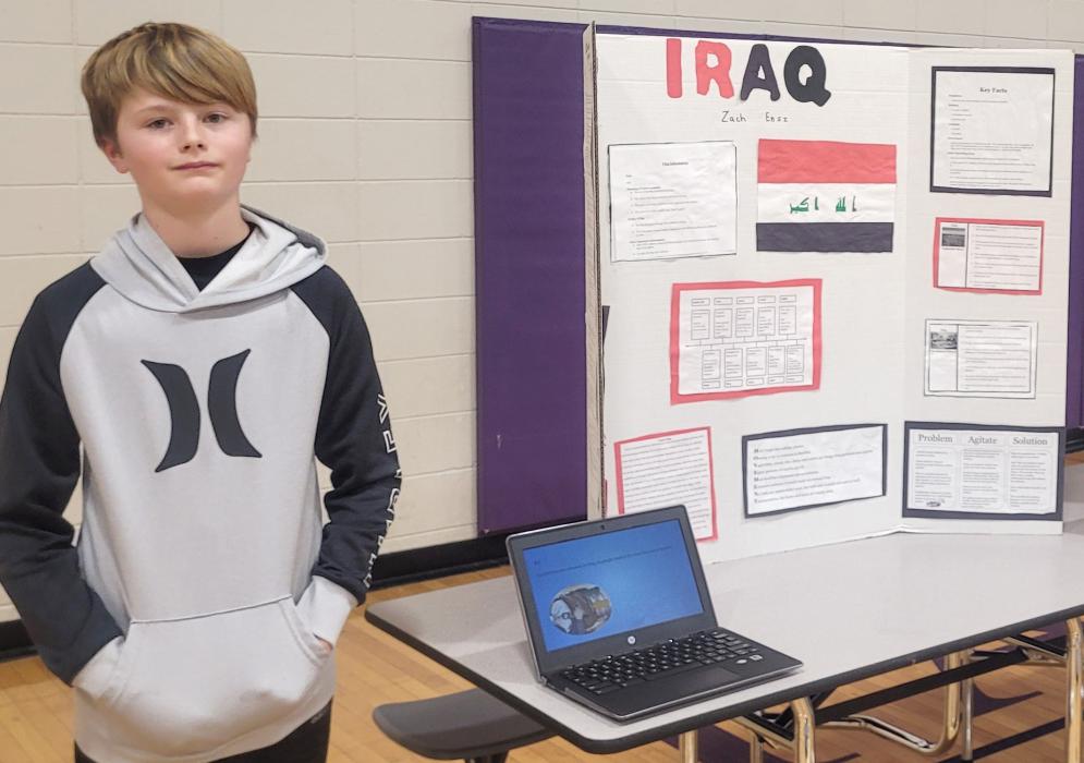 Dakota Dunes resident Zach Ensz shared details about Iraq on Dec. 20th for the 7th Grade Culture Fair. Photo by Kelly Riibe • times2reporter@gmail.com