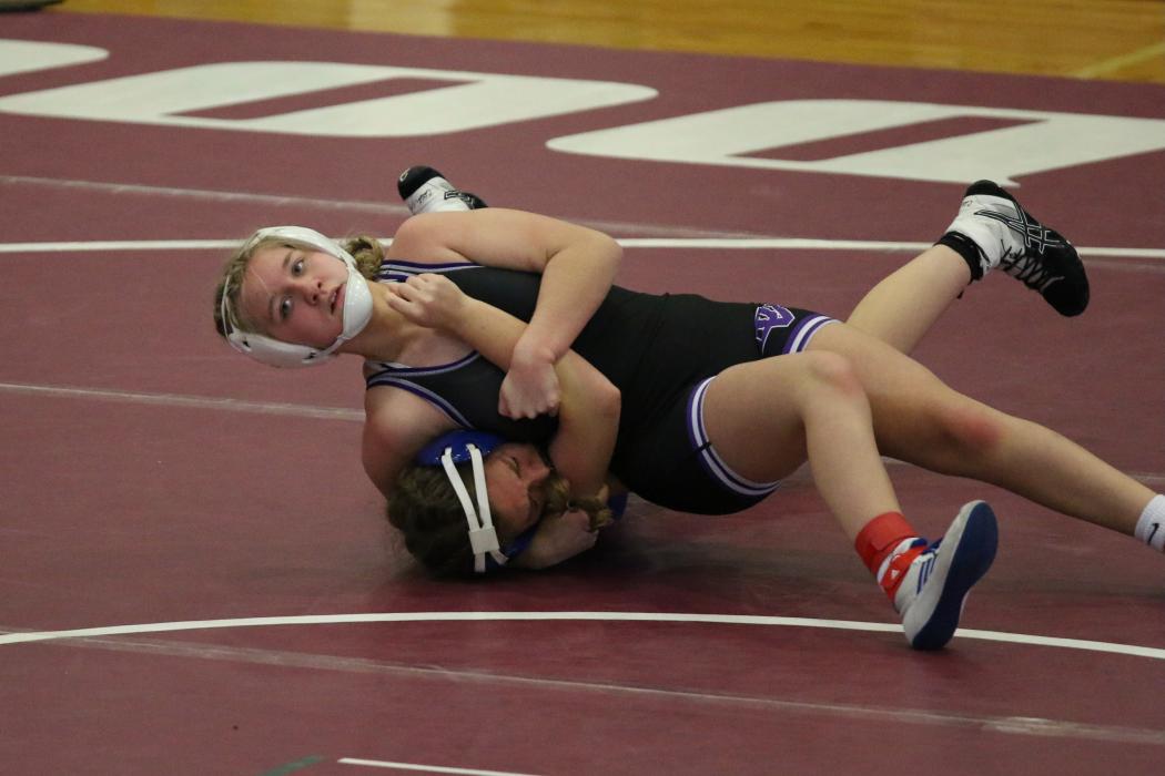 McKenzie Scott looks for the pin in the DAK-XII Conference Wrestling Tournament Jan. 20. She finished 2nd place in the girls 120lb bracket. Submitted photo