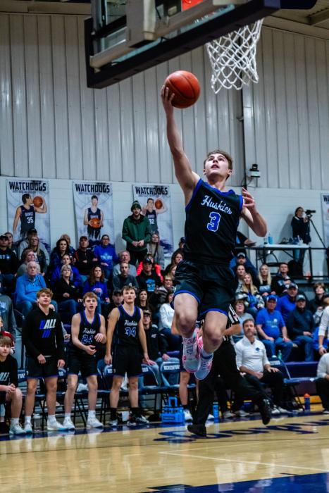 Garrett Merkley goes up for a lay-up off of a fast break. He led the boys with 16 points against Beresford Feb. 9.