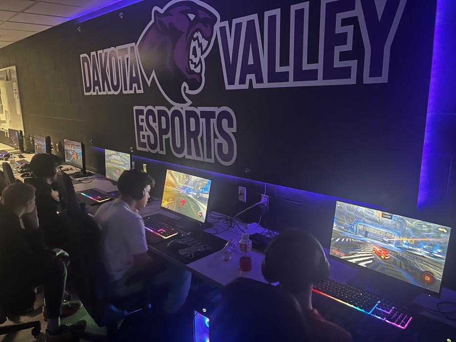 Chance Johnston, Bryan Cardona and Ben Phillips (left to right) compete in Rocket League while Asher Pfeifer looks on from behind. Submitted photo