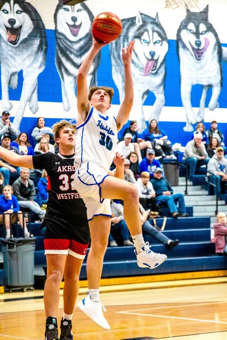 Reed Sayler led the Huskies with 12 points against Akron-Westfield on Jan. 22. Photo by Peterman Sports Photography stevepeterman5@gmail.com