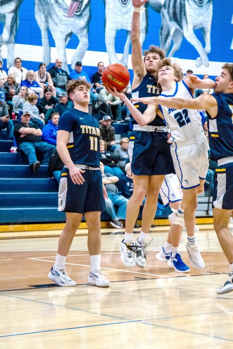 Kayden Moore hits traffic and is fouled on his way to the basket against Tea Area Feb. 16.