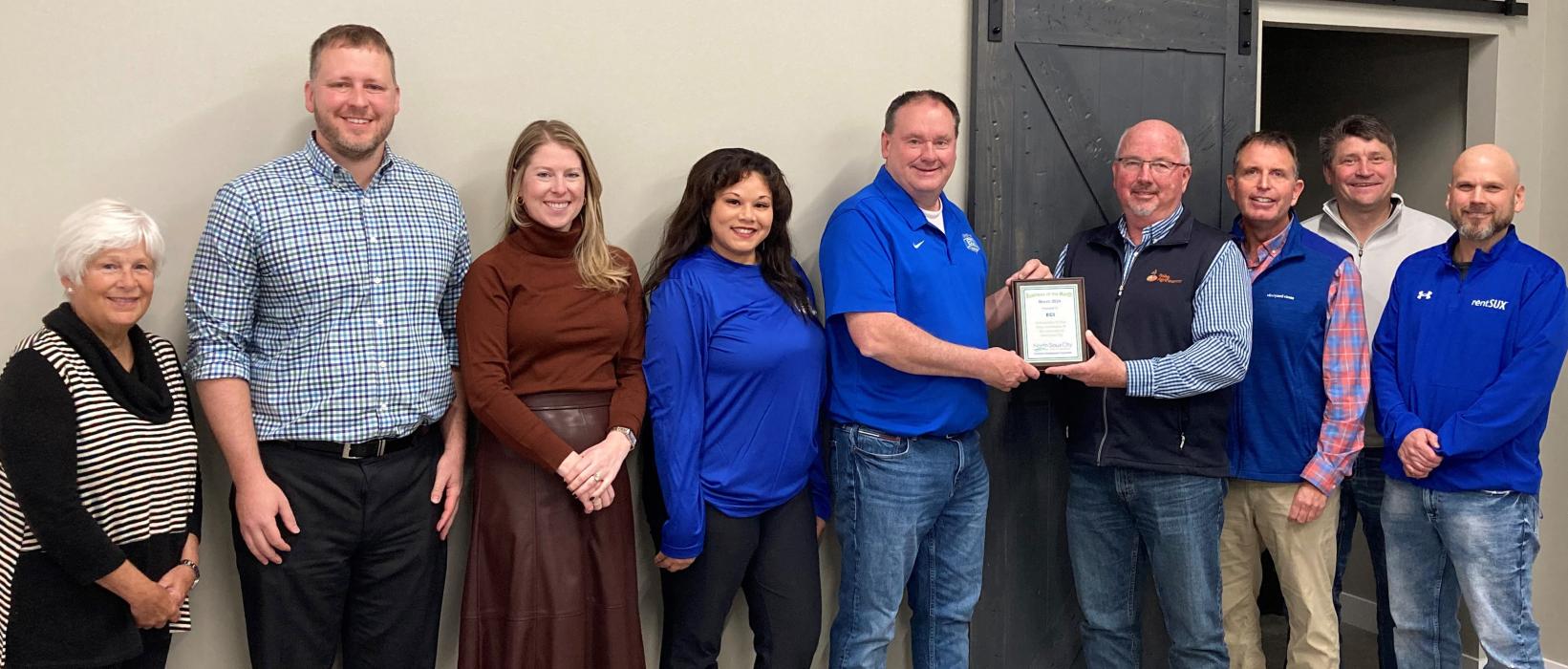 The North Sioux City Economic Development Corporation’s March Business of the Month award was presented to ECI. Pictured are, from left, NSCEDC Director Kathy Gunderson, NSCEDC Executive Director Andrew Nilges, NSCEDC Director Megan Moore, ECI Business &amp; Brand Development Megan Jackson, Tyler Solma, NSCEDC Board President Mike Huber and NSCEDC Directors Jamie Wankum, Kevin Heiss and John Stevens. Submitted photo