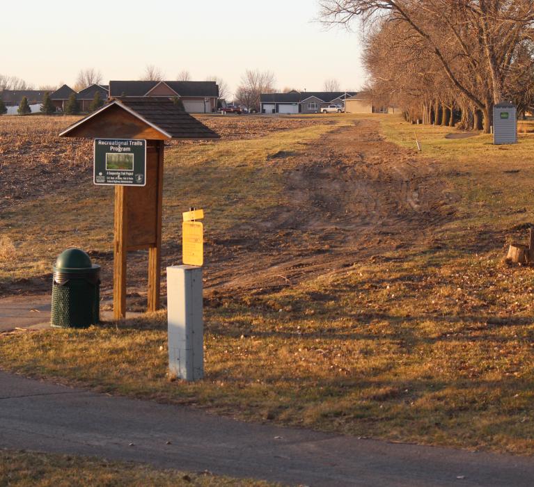 A portion of a bike path along the Elk Point Golf Course was removed in preparation of new construction happening this year in the empty lot by Elk Point Investments, LLC. Photo by Beth Hutcheson • times1reporter@gmail.com