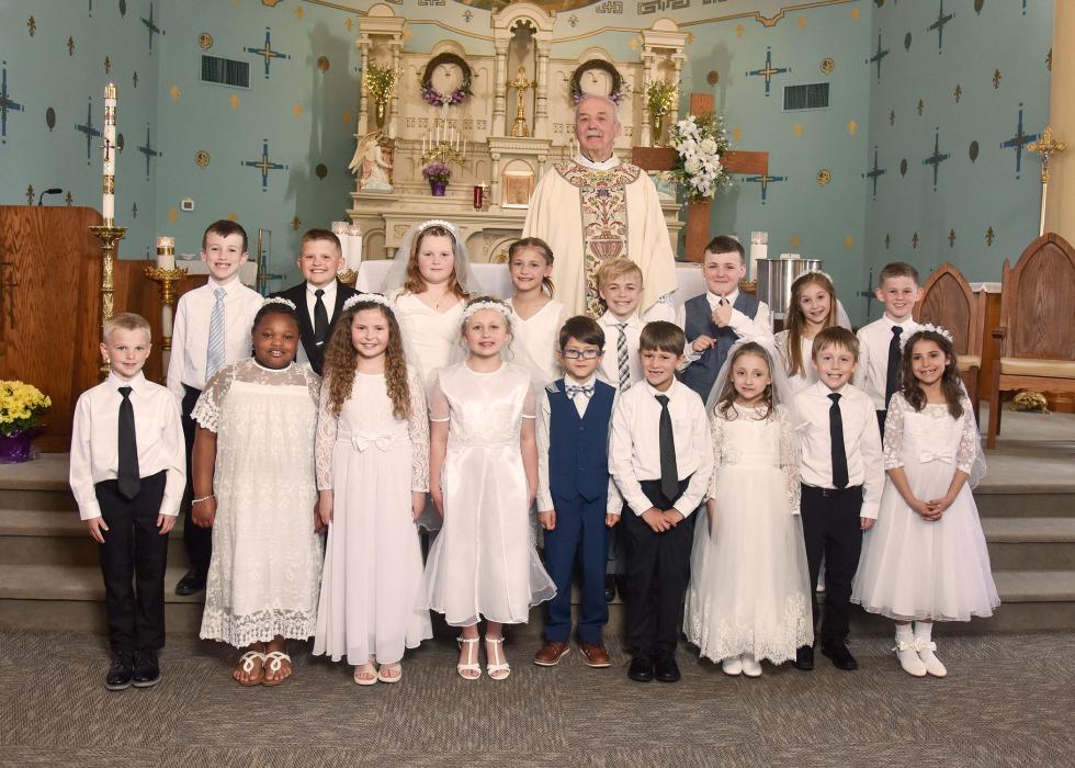 First Communion students for St. Peter and St. Joseph Catholic churches were, from front left, Huxley Haveman, Mya Hammitt, Ashton Donnelly, Leah Donnelly, Miguel Lopez, Reece Chicoine, Ariel Yaneff, Caleb Rupp and Camila Hanson; and back, Hudson Boyle, Raylan Renken, Jenna Sellers, Josie Hutcheson, Keaton Jansen, Bayden Hopper, Annalisa Hanson, Henrik Holgate, and Father Joe Vogel.