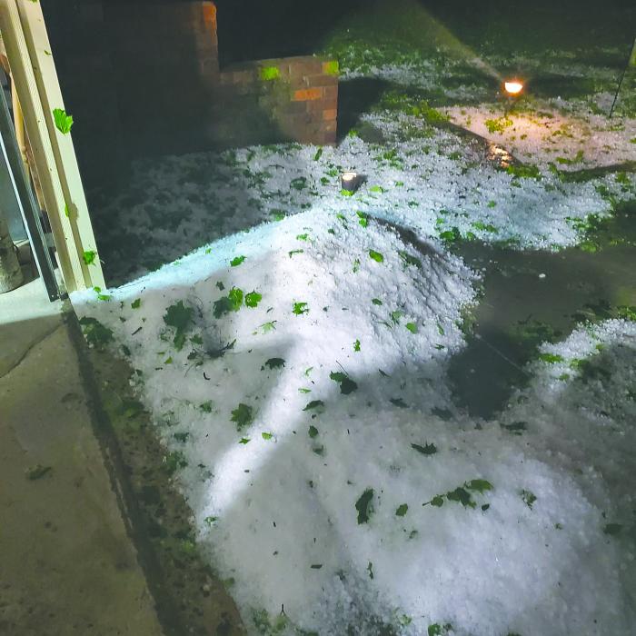 A hail bank piled up in front of Mike and Kathy Lawler’s garage at 211 E Washington. Submitted photo
