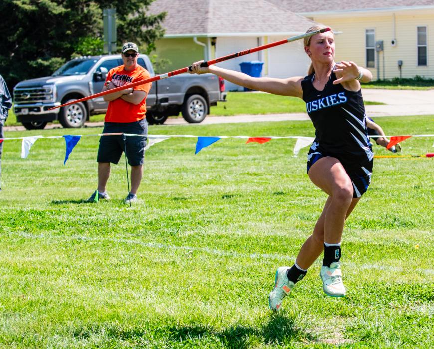 Bentlee Kollbaum throws the javelin May 14 at the Huskies home meet. Photo by Peterman Sports Photography • stevepeterman5@gmail.com