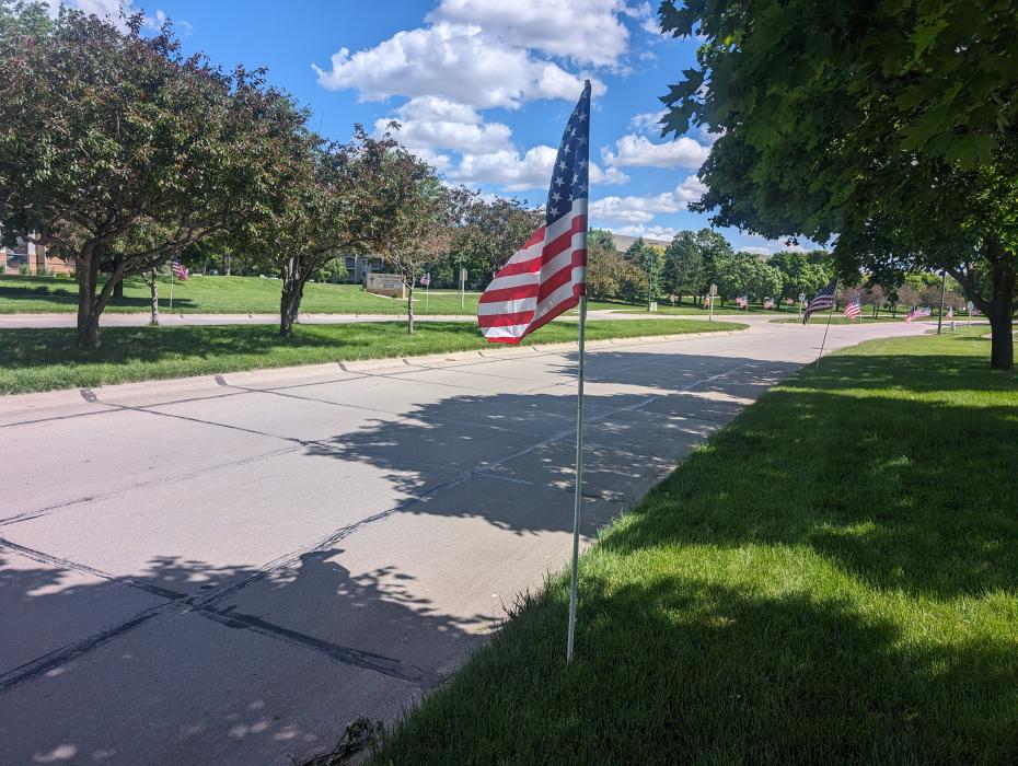 American flags lined Dakota Dunes Boulevard on Monday, May 27, in honor of Memorial Day. The flags began at the start of the residential entrance area leading to the Prairie and the Meadows and extended into the Country Club neighborhood. It was a beautiful site. See more Memorial Day photos on page 10. Photo by Kelly Riibe • times2reporter@gmail.com