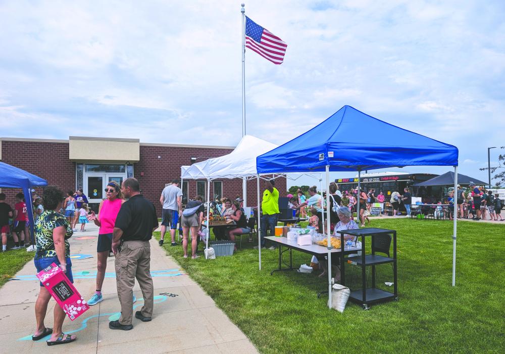 It was a great day for the North Sioux City Community Library on Tuesday, June 4 as they kicked off their summer ready program with a big community party. Many attended and were able to play games, enjoy lunch, slide down water inflatables and eat snow cones.