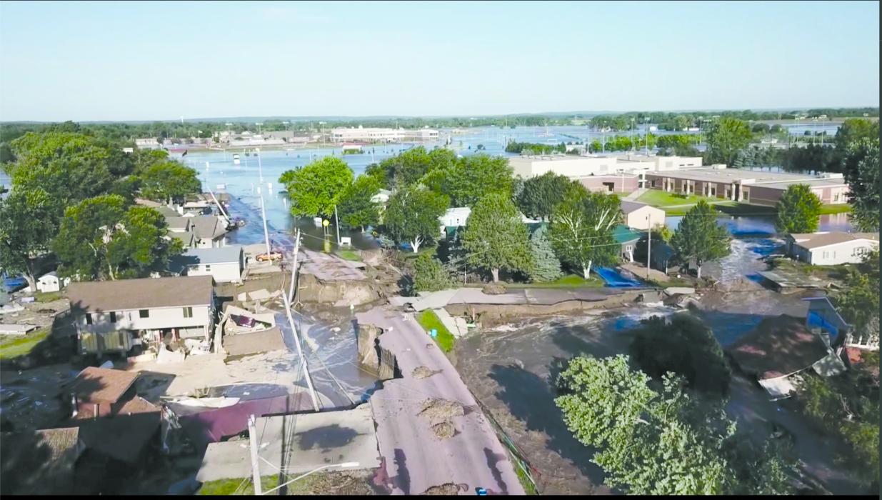 The Dakota Valley Schools are shown on the top right corner and top middle in the background. The destruction caused to Northshore Drive and area homes is also evident. Photo courtesy of Shaun Florke