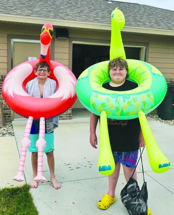 Floaty Friday at the Elk Point Pool from left: Jackson Sharkey the flamingo and Zaden Raber the Dino wear thier floaties. Submitted photo