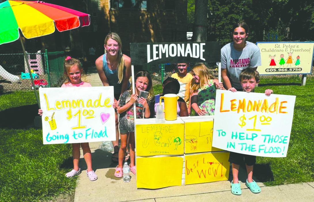 Children from St. Peter’s Child Care sold lemonade on Friday, June 26, to benefit the flood victims. Submitted photo