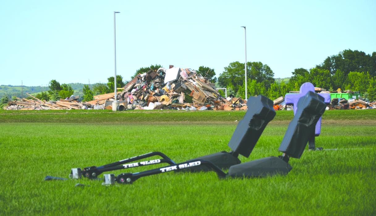 Flood relief efforts include debris removal in the local area. Piles were made near the Dakota Valley school. Photo by Kelly Riibe • times2reporter@gmail.com