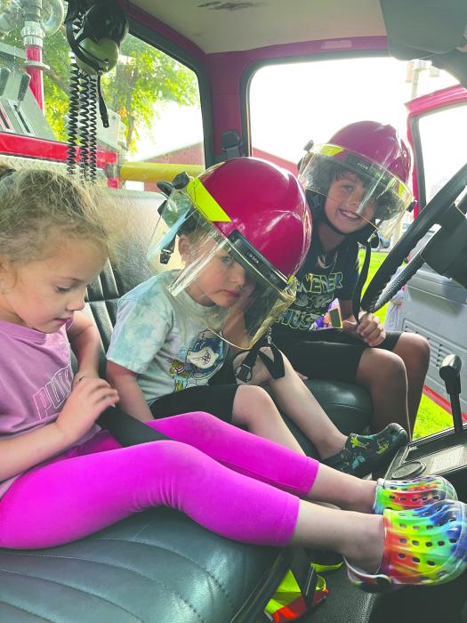 Kids got to check out the interior of a fire truck at National Night Out in Jefferson on Tuesday, Aug 6. L-R: Aubrey Chicoine, Lane Mitchell, Carter Rarrat. Submitted photo