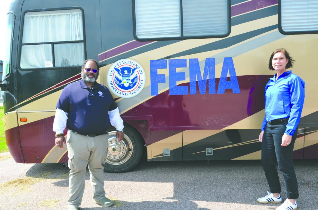 Tony Mayne and Claudia Anderson stand in front of the FEMA mobile unit outside the Disaster Relief Center in North Sioux City. Photo by Kelly Riibe • times2reporter@gmail.com