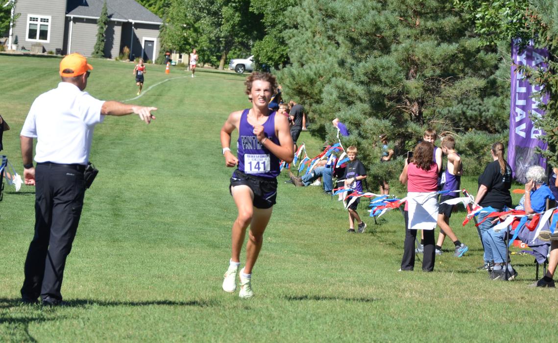 A meet director points Jack Brown towards the finish line as the DV Senior won the race on August 30, 2024. Photo by Kelly Riibe • times2reporter@gmail.com
