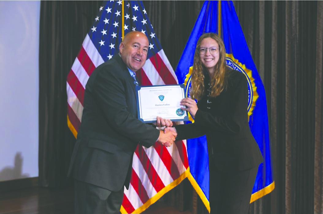Danica Euliss, a Dakota Valley High School junior receives her certification of completion from the FBI's Youth Leadership Program in Quantico, VA. Submitted photo