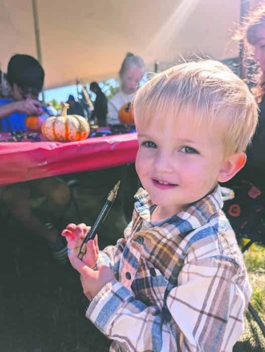 Beckett Ginkens, of Dakota Dunes, enjoyed pumpkin painting at the Fall Festival on Oct. 6, 2024. Photos by Kelly Riibe times2reporter@gmail.com