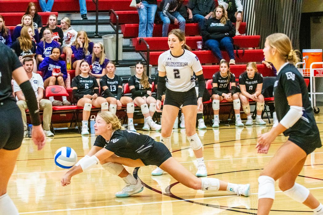 Sammy Kimbell makes a diving pass for the Panthers. Next to her in the backrow is #2 Reagan Granstrom and Coryn Kimbell.