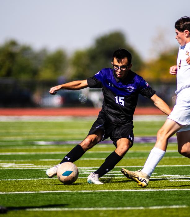 Panther senior Mark Wren goes for the ball against a Groton opponent on October 5, 2024.