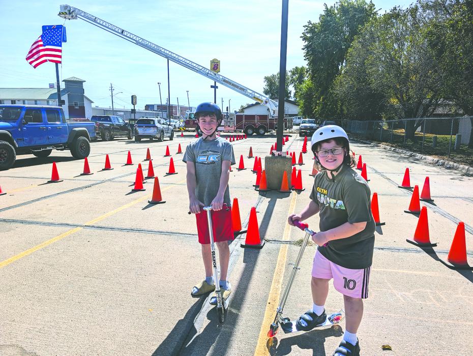 Bentley Watterson and Gracen Beatty, of North Sioux City, had fun riding their scooters through a course of orange safety cones at NSC’s Annual Open House on Oct. 13, 2024. Photo by Kelly Riibe • times2reporter@gmail.com