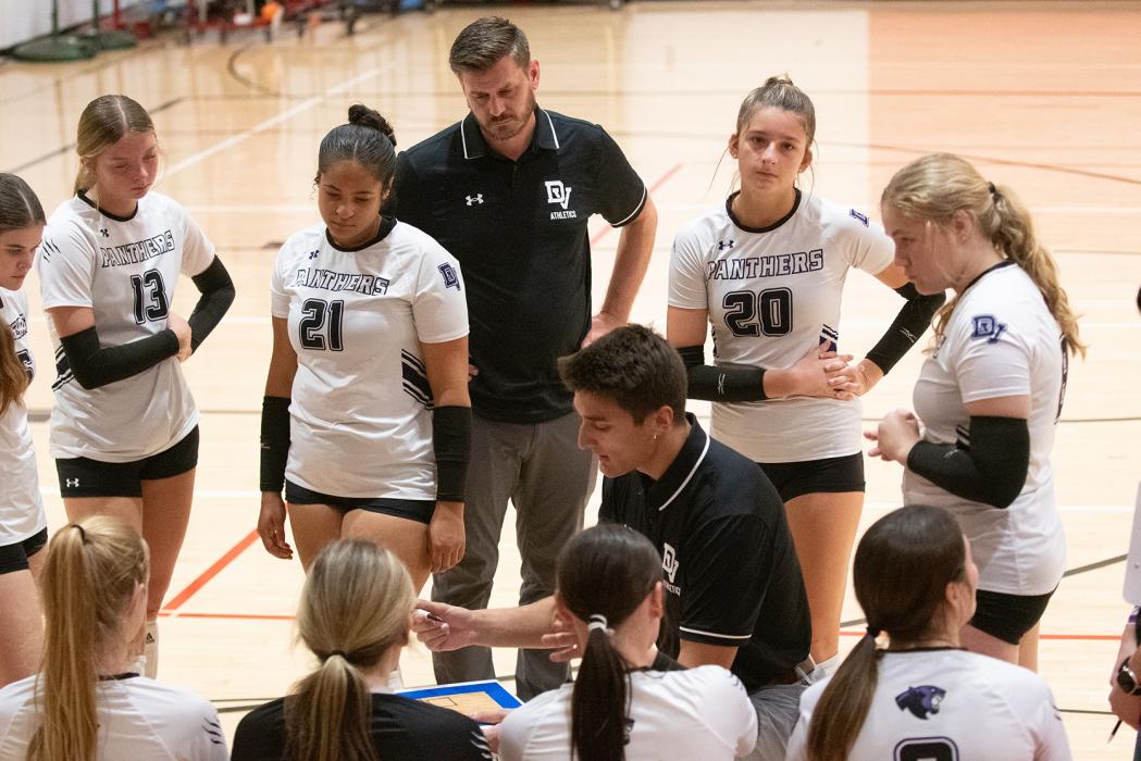 Coach Erik Krenz, in the middle, talks to his Panther volleyball team during a huddle on Saturday, Oct. 19th. Photos by Peterman Sports Photography • stevepeterman5@gmail.com