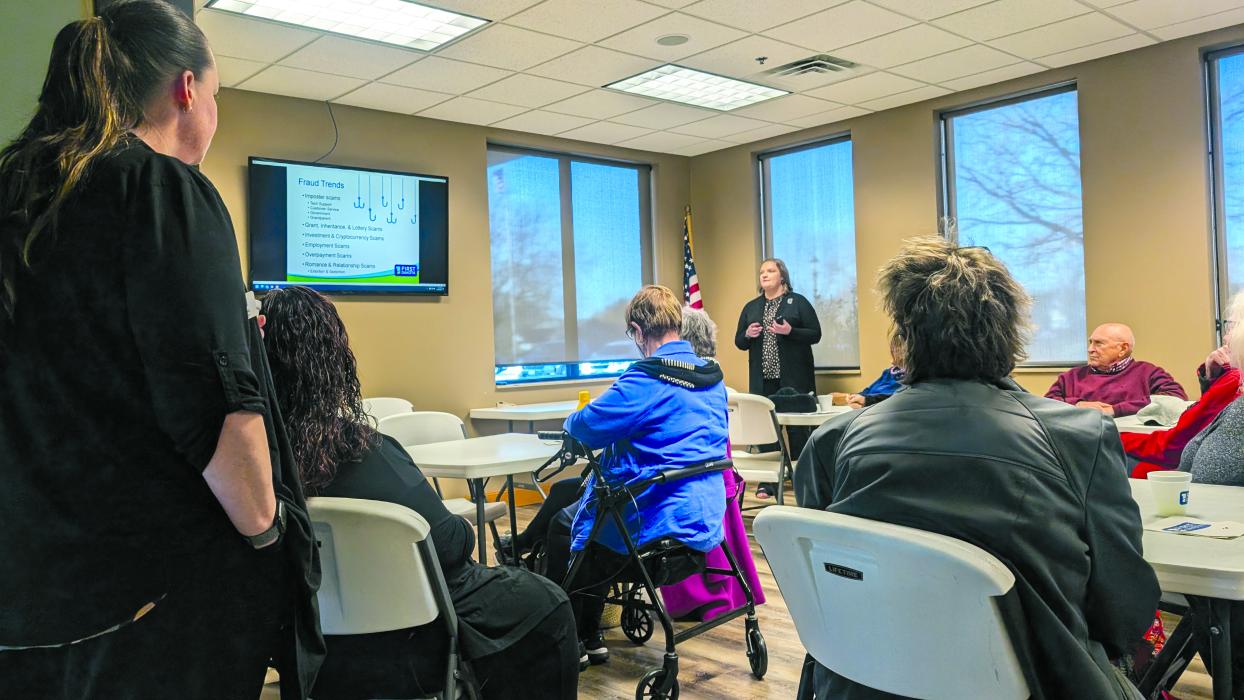 Maggie Jennings, a Risk Management and Fraud Prevention Officer with First Dakota in Sioux Falls visits with residents about fraud trends. Photo by Kelly Riibe • times2reporter@gmail.com