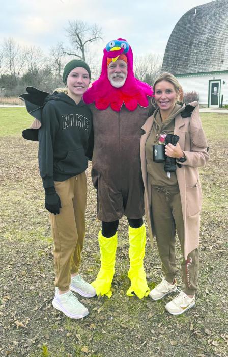 Residents of Dakota Dunes, Katy and Jaycie Rush, were at the Turkey Trot this past Thanksgiving. The volunteer fun run took place at Adams Homestead and Nature Preserve and donations of non-perishable food items were collected by the Missouri River Runners. From left: Jaycie Rush, Phil Breed, and Katy Rush. Submitted photo