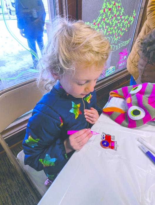 Arie Schooley, of Elk Point, decorated an ornament while attending the Christmas Market on Nov. 30, 2024. Photo by Kelly Riibe • times2reporter@gmail.com