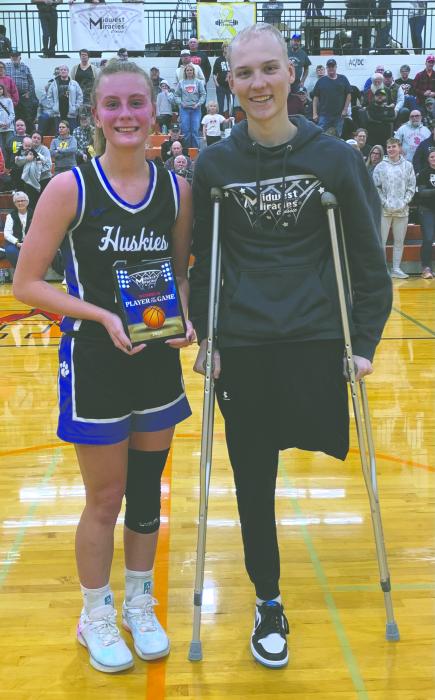 Bentlee Kollbaum, an EPJ senior basketball player, was named player of the game at the Midwest Miracle Classic on Saturday, January 4, 2025. From left: Bentlee Kollbaum, and Tourney Director Kobee Sherman. Submitted photo