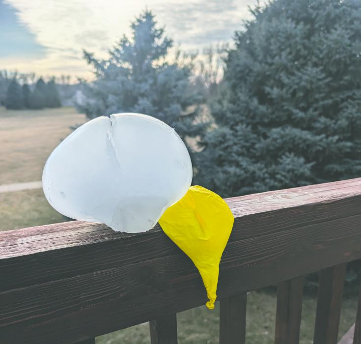 Arctic temperatures, on January 20-21, 2025, meant this water balloon did not last long in liquid form. It froze solid at a rapid speed and then busted out of its balloon restraint while on an outside deck in Dakota Dunes. Photo by Kelly Riibe • times2reporter@gmail.com