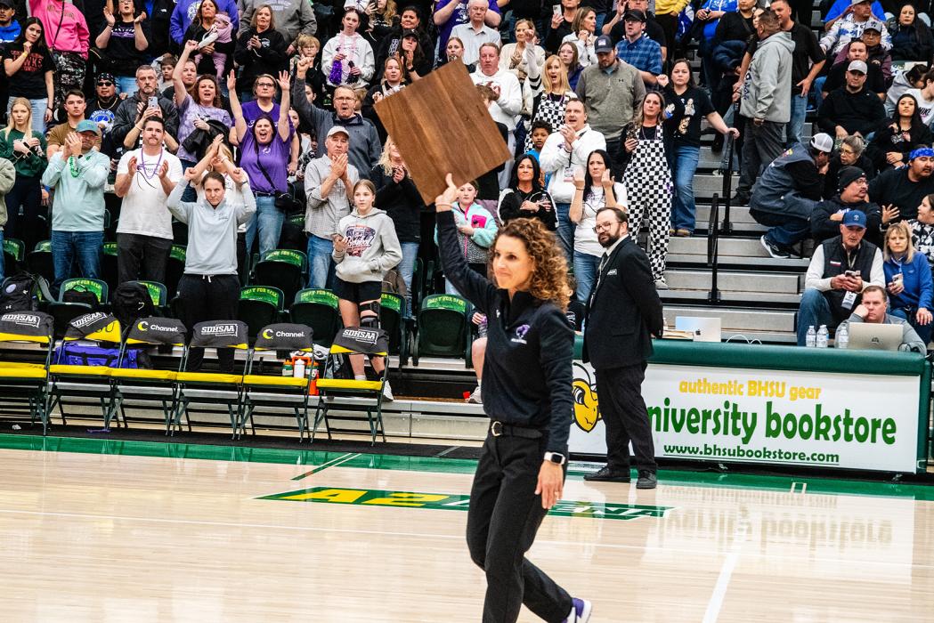 Dakota Valley Head Coach Tammy Lilly holds up the state plaque for her team to see on March 15, 2025. Photos by Peterman Sports Photography • stevepeterman5@gmail.com