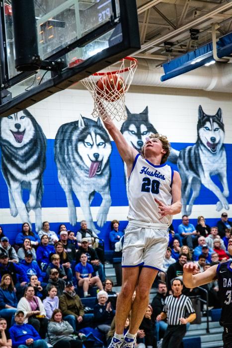 Grayson Girard takes it to the hoop for the Huskies in the game versus Beresford. Photo by Peterman Sports Photography stevepeterman5@gmail.com