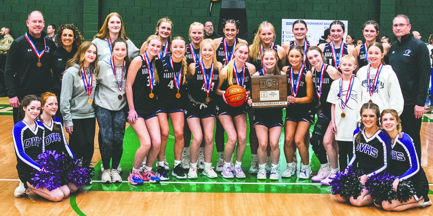 Dakota Valley Head Coach Tammy Lilly holds up the state plaque for her team to see on March 15, 2025. Photos by Peterman Sports Photography • stevepeterman5@gmail.com
