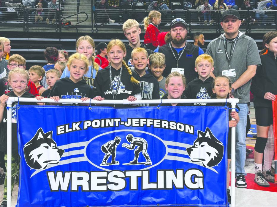 The Huskies carried a banner in the parade of teams for the 2025 youth state wrestling tournament in Rapid City. The parade took place on Sunday, March 30, 2025 prior to the medal round matches.
