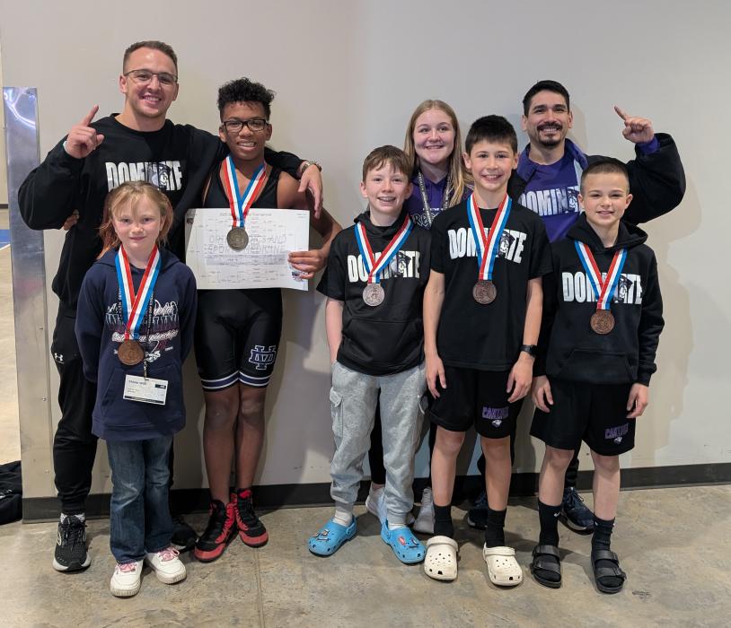 Panther youth wrestling brought home 6 medals from the state wrestling tournament in Rapid City on March 28-30, 2025. Placewinners are seen here with their coaches. Back row from left: Coach Nic Madison, Dre Connell, Kenzie Scott, and Coach Adrian Jurado. Front row from left: Khloie Willi, Graham Riibe, Glen Sellers, and Henry Reis. Photo by Kelly Riibe • times2reporter@gmail.com