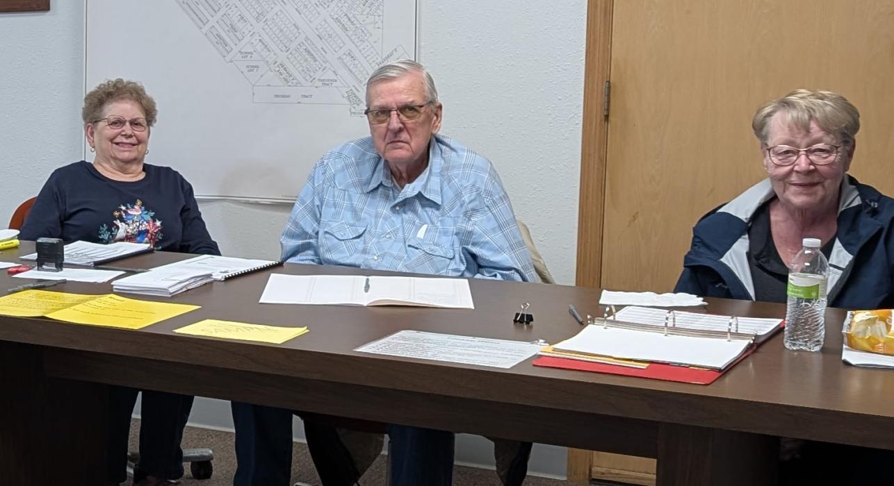 Voting for some area residents took place at city hall in Jefferson on April 8, 2025. Polling workers were on-site to assist voters. From left: Janna Whitlock, Dan Whitlock, and Susie Collins. Photo by Kelly Riibe • times2reporter@gmail.com