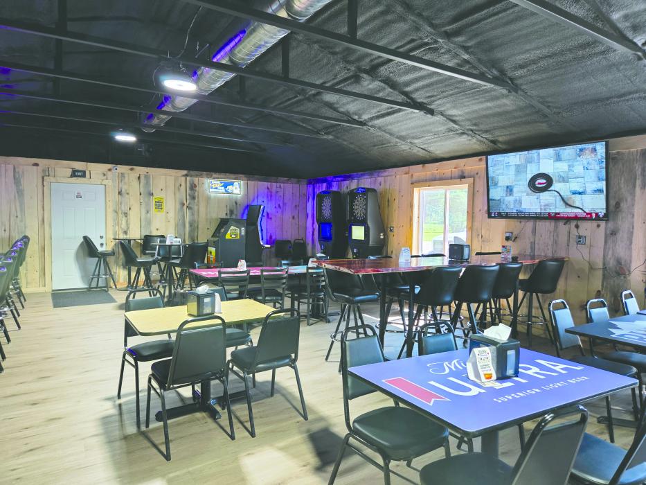 The new addition at Ollie’s Out Back offers a warm, family-friendly space to unwind, complete with cozy seating, arcade games, and a handcrafted bar that blends hometown charm with modern flair.