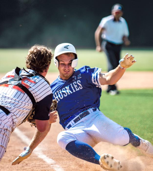 Ashton Fairbanks slides into home plate for an in-the-park home run against Lennox. Photo by Peterman Sports Photography • stevepeterman5@gmail.com