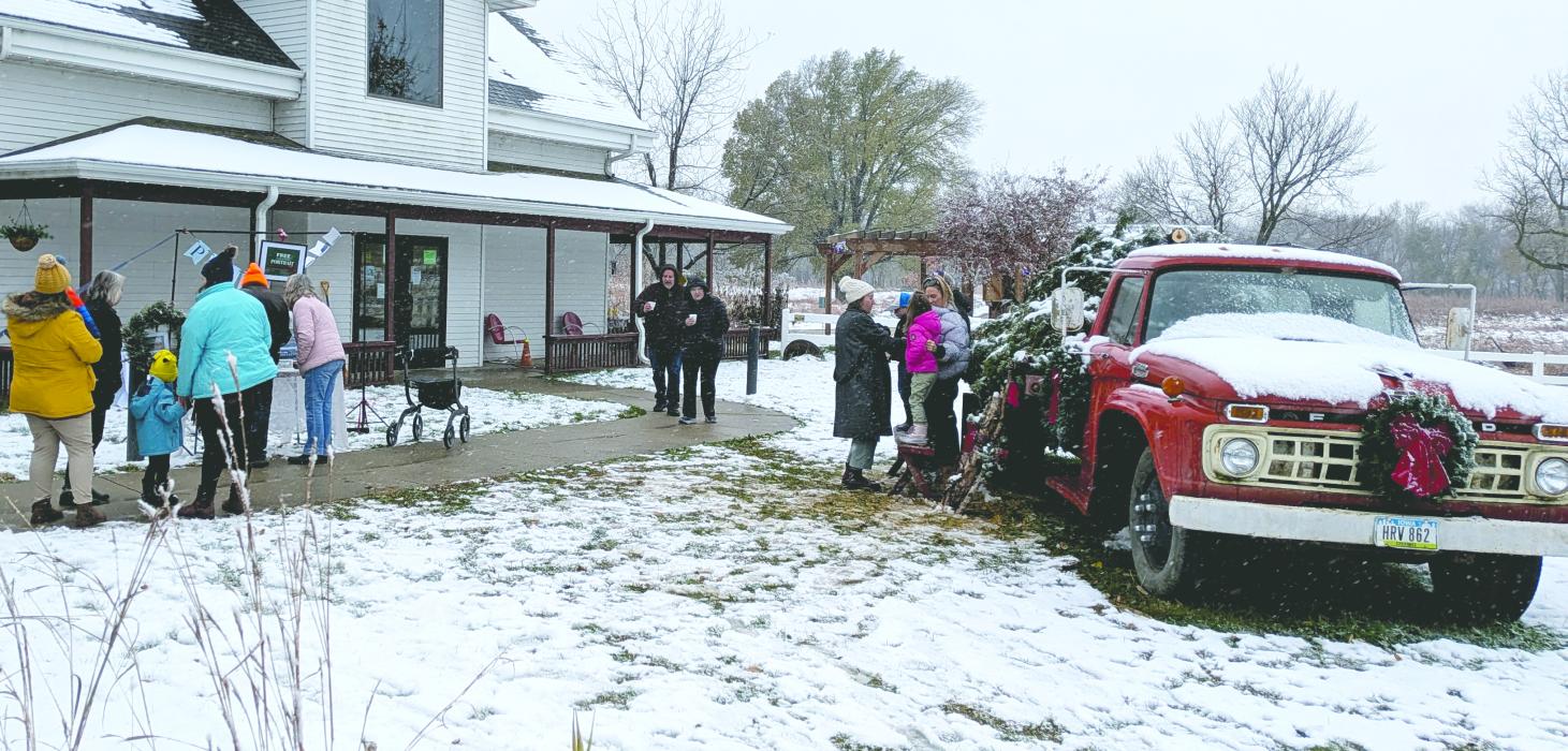 Steady crowds braved the snow Nov. 8 for this year’s “Christmas at the Homestead” at Adams Homestead and Nature Preserve, where visitors enjoyed holiday crafts, caroling, treats and tours of historic buildings decorated for the season. Photo by Kelly Riibe • times2reporter@gmail.com