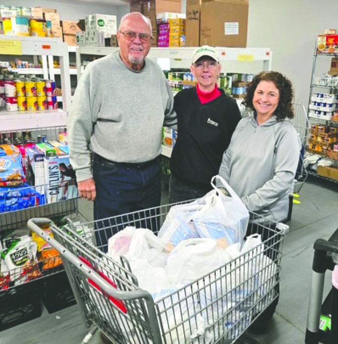 From left, Doug and Cathy Maurstad present donated supplies to Elk Point Food Pantry Manager Tam Edgar. The items were purchased with a $250 Thrivent grant secured by St. Paul Lutheran member Dorothy Langle. Submitted photo
