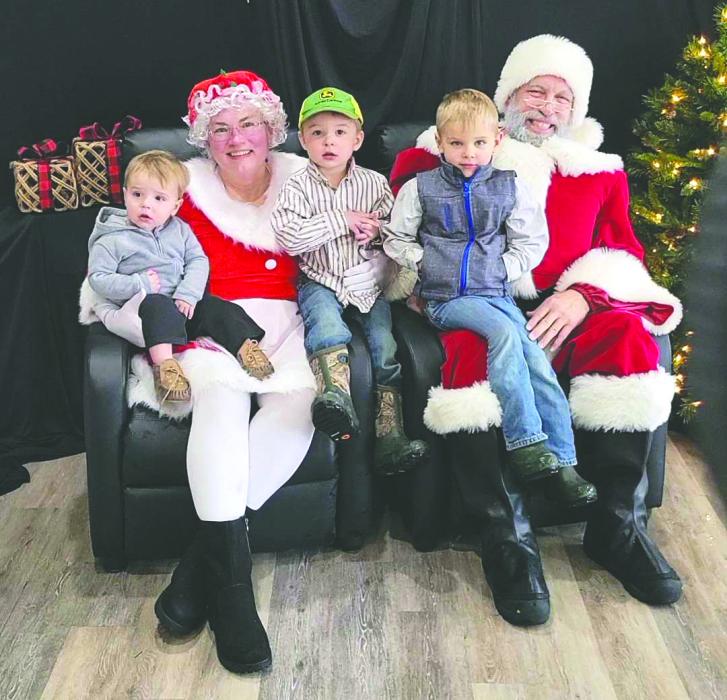 Santa and Mrs. Claus share smiles with children at Elk Point’s Hometown Christmas Market, a highlight of the downtown holiday celebration. Submitted photo