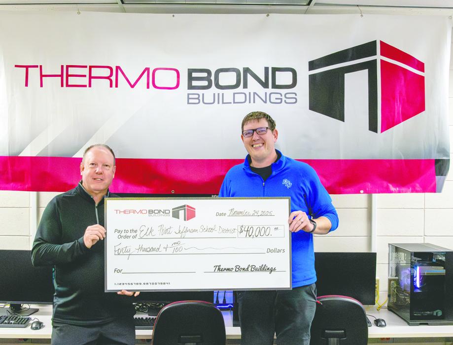 Bill Riley, president and CEO of Thermo Bond Buildings, LLC, presents a $40,000 donation to Elk Point‑Jefferson Superintendent Philip Schonebaum on Nov. 25, 2025, in Elk Point. The contribution will support technology and career education programs for EPJ students. Photo by Peterman Sports Photography • stevepeterman5@gmail.com