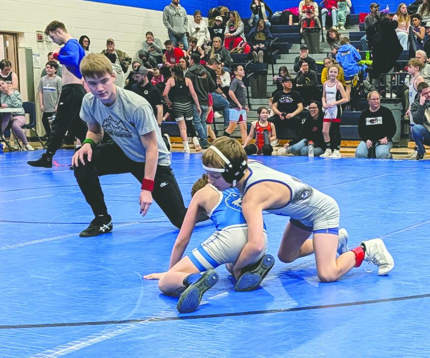 Ezra Fischer, of Elk Point, works for points during his tournament match on January 25, 2026. Fischer is seen here in the top position with head gear. Photo by Kelly Riibe • times2reporter@gmail.com