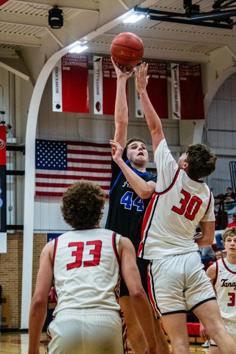 Eli Connors gets high for the ball as the Huskies battled the Vermillion Tanagers on March 2nd.