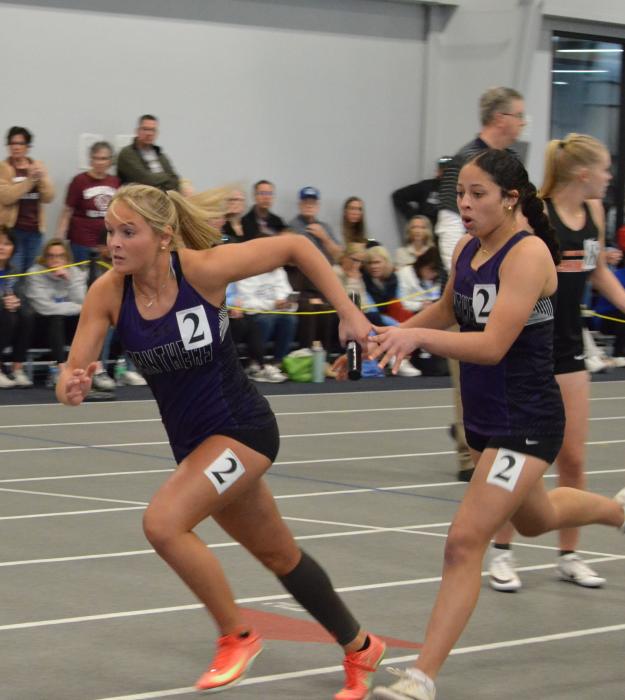 The DV girls 4x200 relay team ran a 1:54.38 at the Yankton indoor meet on March 27th. From left: Ava Squier reaches for the baton from Ava Buck.