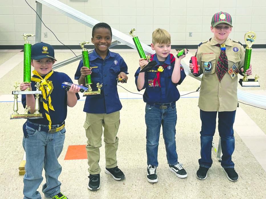 Scouts from Pack 48 take part in the 26th Annual Pinewood Derby on March 22. Pictured from left are Lincoln Pedersen, Kendy Pierre, Liam Wilkes and Carter Hun. Submitted photo